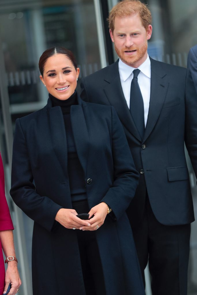 Meghan Markle and Prince Harry in matching black suits