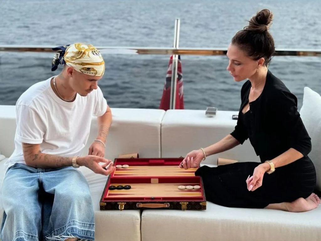 Romeo Beckham and mum Victoria Beckham playing backgammon