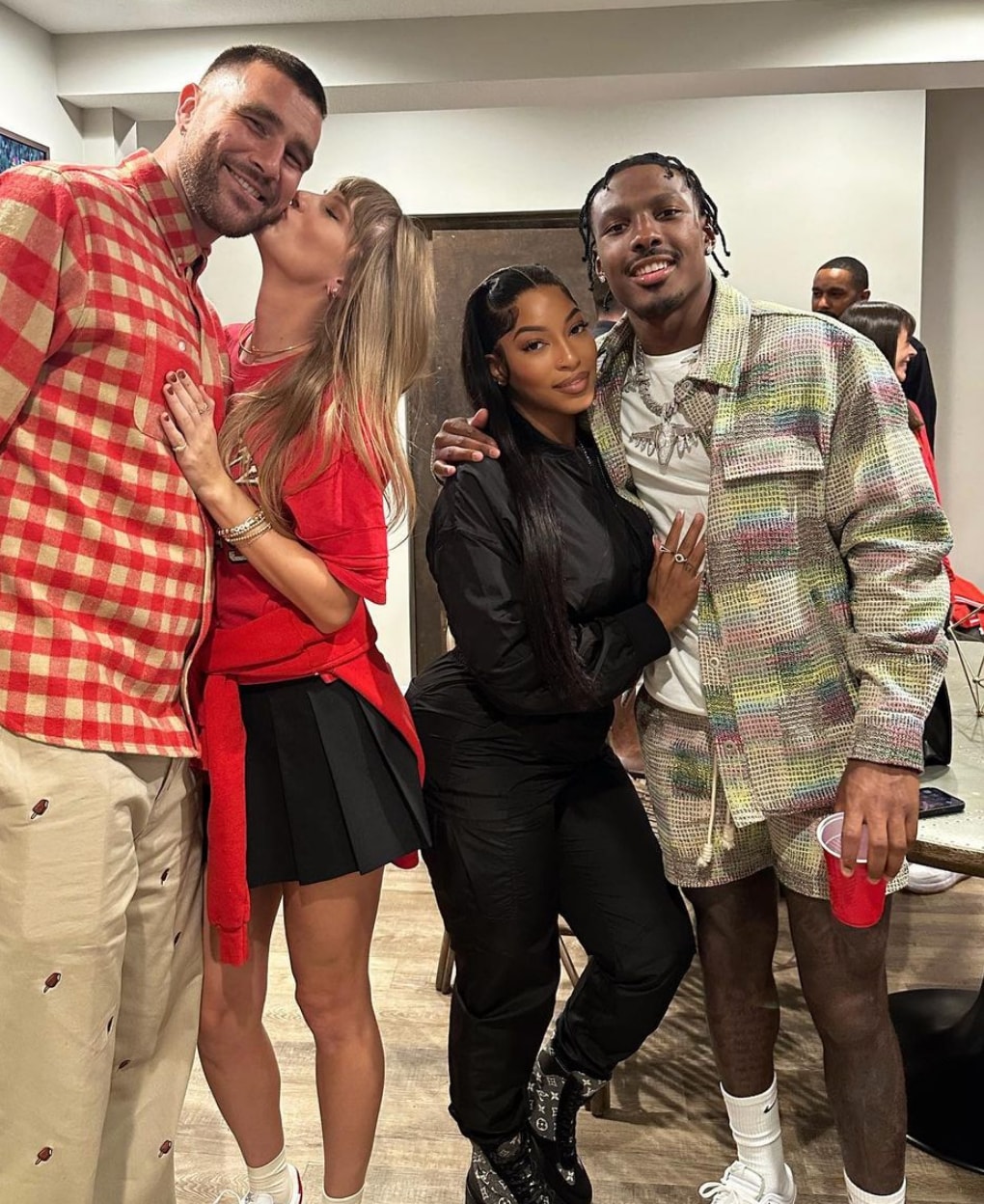 Photo shared by Kansas City Chiefs player Mecole Hardman Jr's wfie Chariah Gordon on Instagram October 23, 2023 where the couple is posing next to Taylor Swift and Travis Kelce
