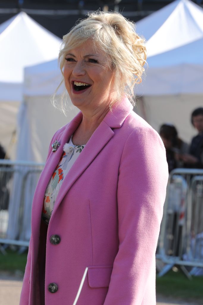 Carol Kirkwood smiling in pink