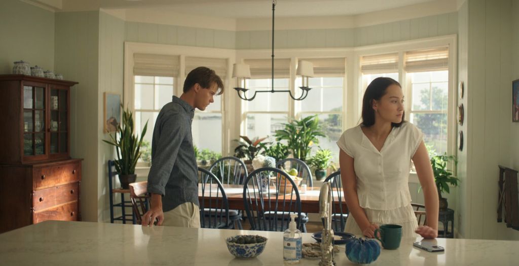 Belly wearing a white v-neck reformation top and shorts on episode 8 of the summer i turned pretty