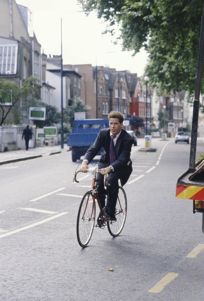 David cycling in a suit in 1988
