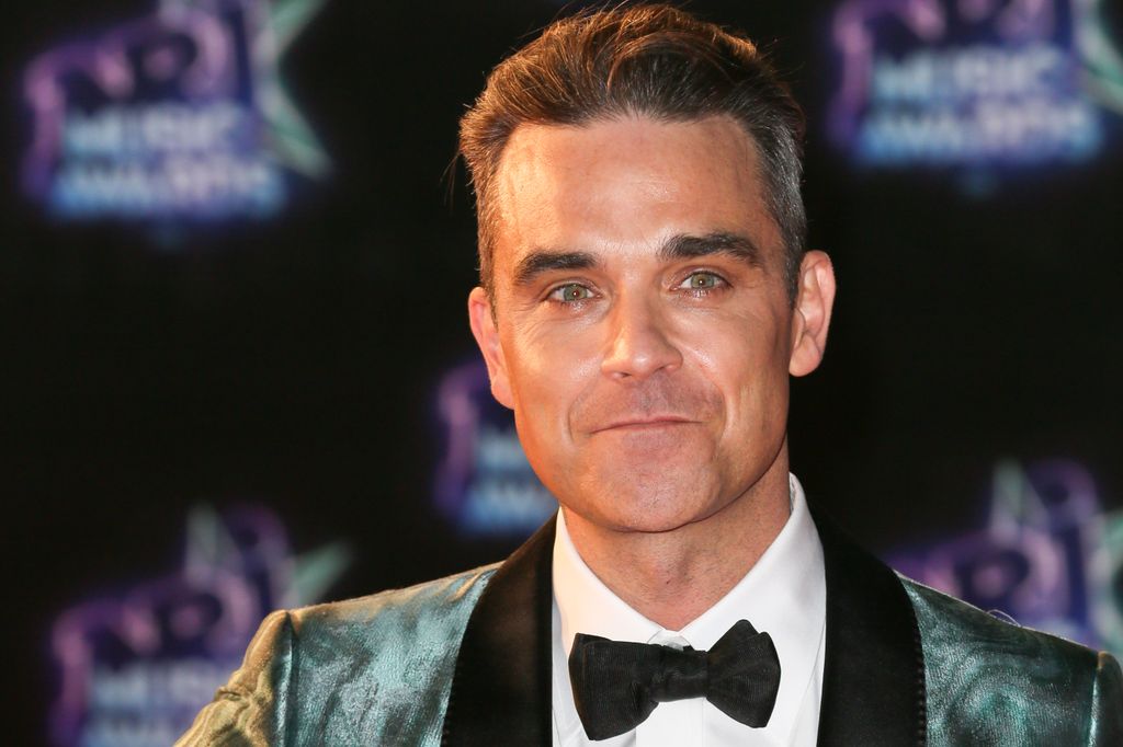 Robbie Williams arrives at the 18th NRJ Music Awards at the Palais des Festivals on November 12, 2016 in Cannes, France