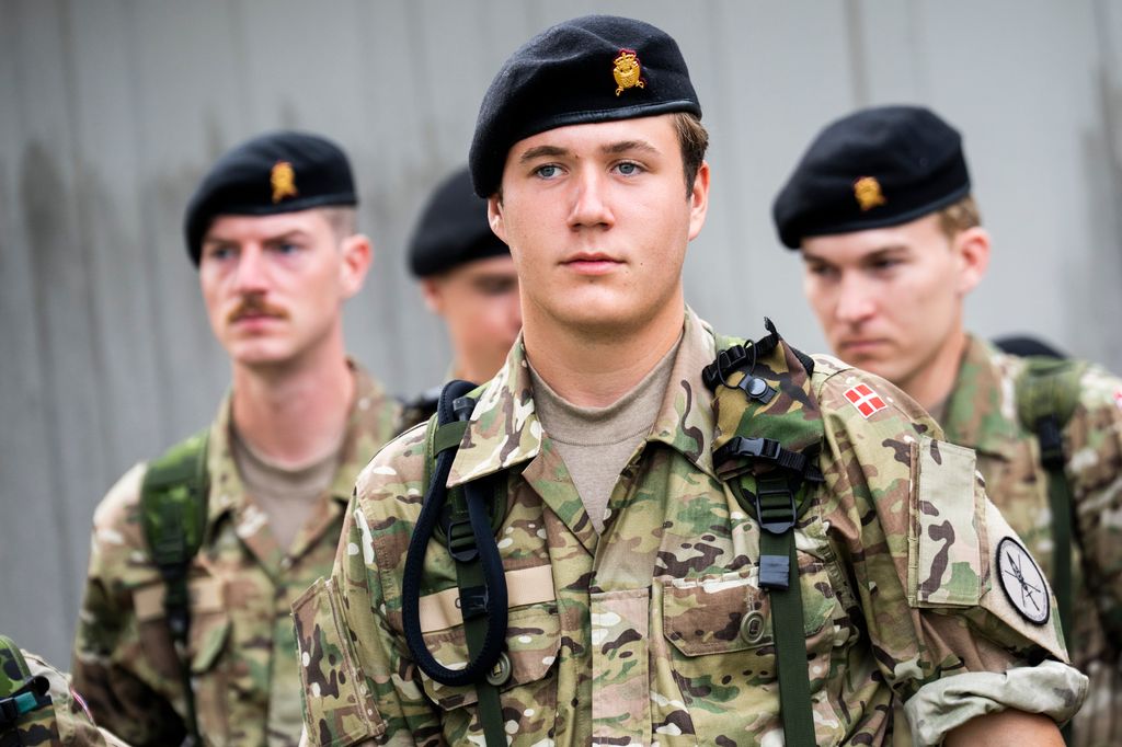 Crown Prince Christian in military uniform with other trainees