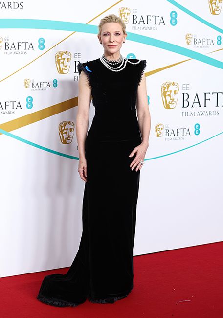 cate blanchett in simple black dress with pearl necklaces at baftas