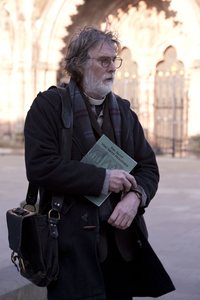 reverend walking outside church