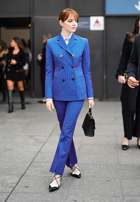 Emma Stone is the epitome of chic in a pinstripe suit at Louis