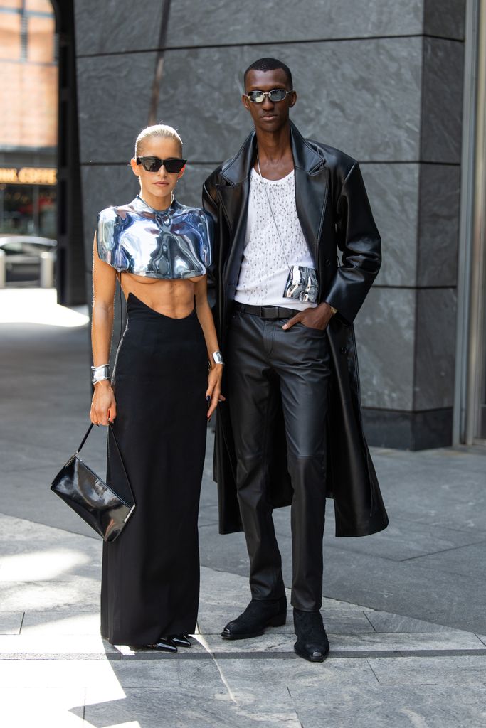 Caroline Caro Daur wears silver cropped top, black skirt, bag & Alioune Badara Fall wears black leather coat, pants outside Grace Ling during New York Fashion Week on September 06, 2024 in New York City. (Photo by Christian Vierig/Getty Images)