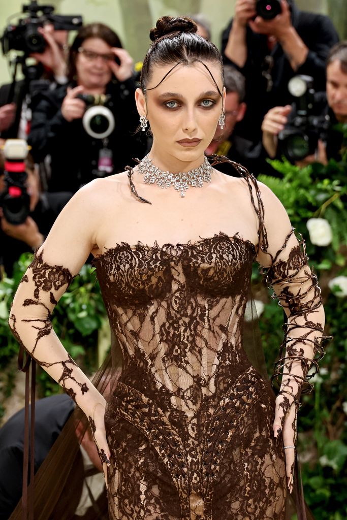 Emma Chamberlain in gothic makeup and a lace dress at the Met Gala