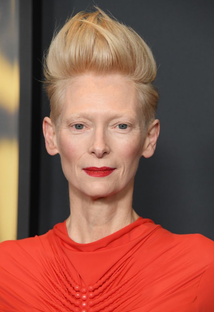 Tilda on the red carpet with a red lip and dress