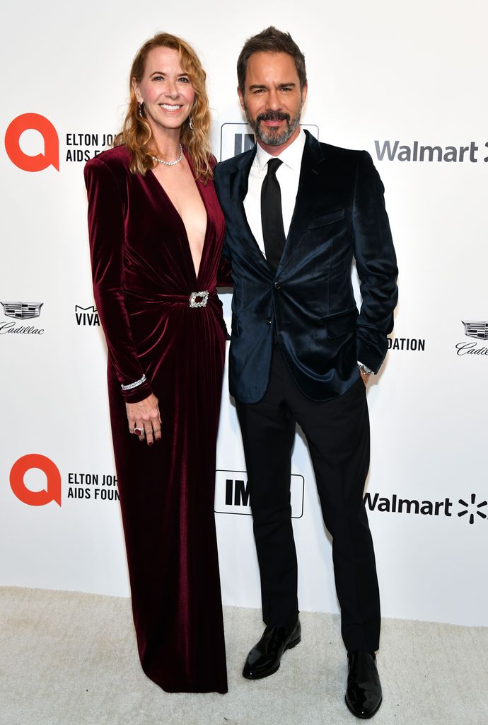 Janet Holden standing with Eric McCormack