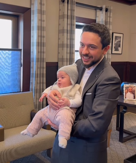 Proud dad Hussein with baby Iman at his office