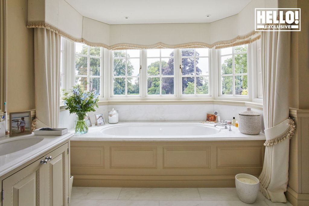 Charlie and Yoanna Hanbury home beige bathroom with bay window