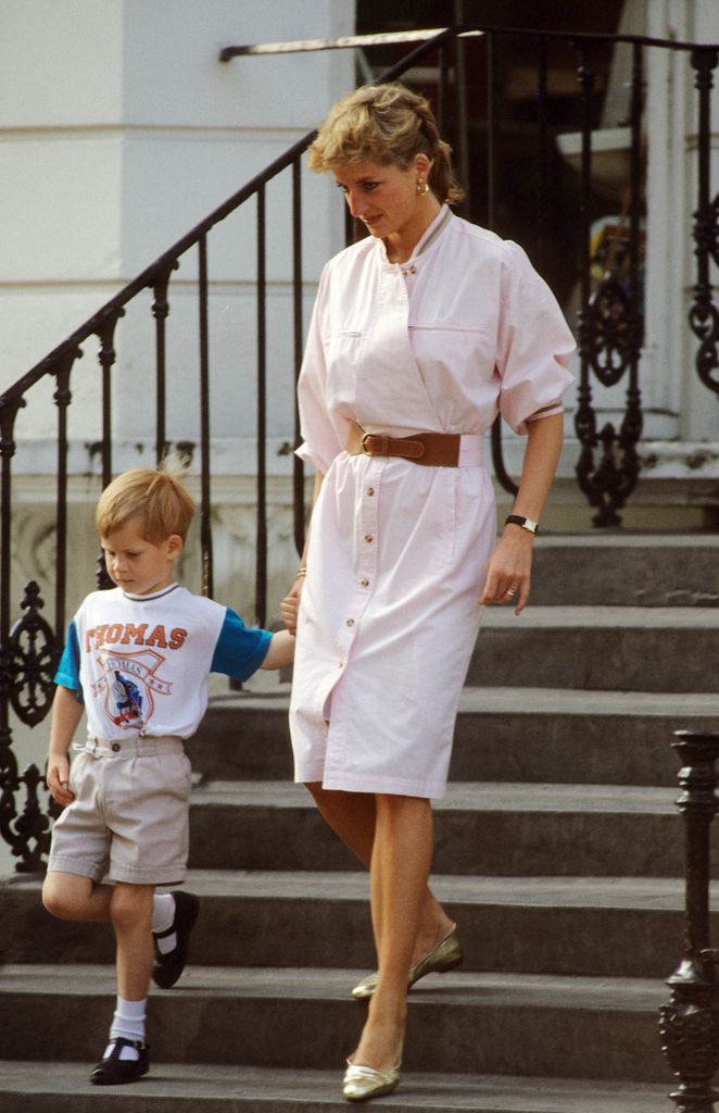 The stylish royal wore a belted pale pink utility-style midi dress to pick up Prince Harry after nursery 