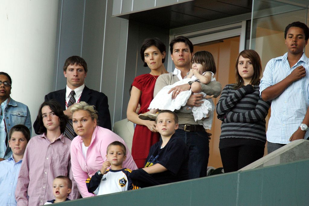 Tom Cruise (C) and Katie Holmes with daughters Suri Cruise and Isabella Kidman-Cruise (2nd R) and son Connor Kidman-Cruise (R) watch the Major League Soccer match between New York Red Bulls and LA Galaxy at the Home Depot Center in 2008
