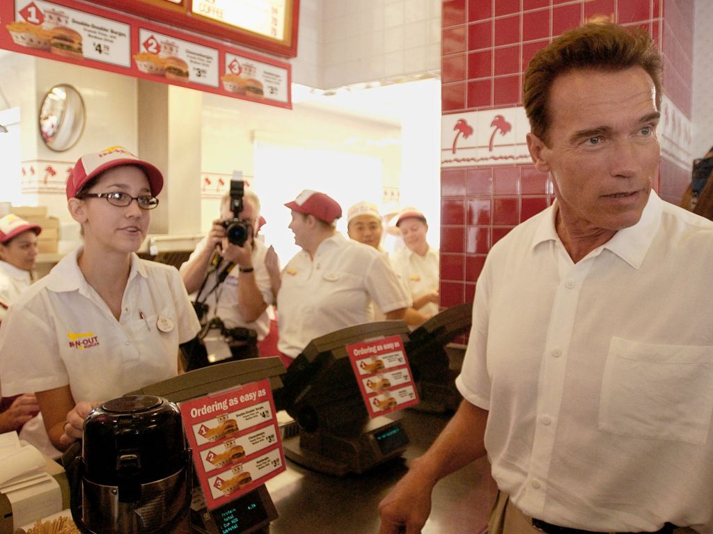 California gubernatorial candidate Arnold Schwarzenegger places an order at an "IN & Out" restaurant during a lunch break on his "California Comeback" bus tour in October 4, 2003 Merced, California. This is the final weekend before the recall vote on October 7.