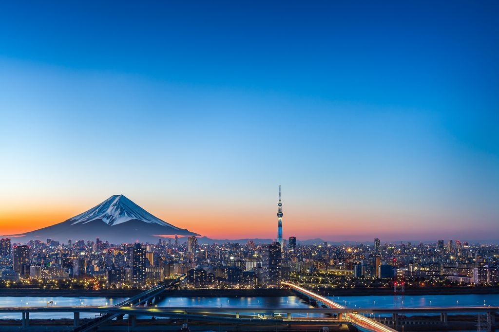 Urban sunset view with high rise buildings, and Mount Fuji, Tokyo Japan