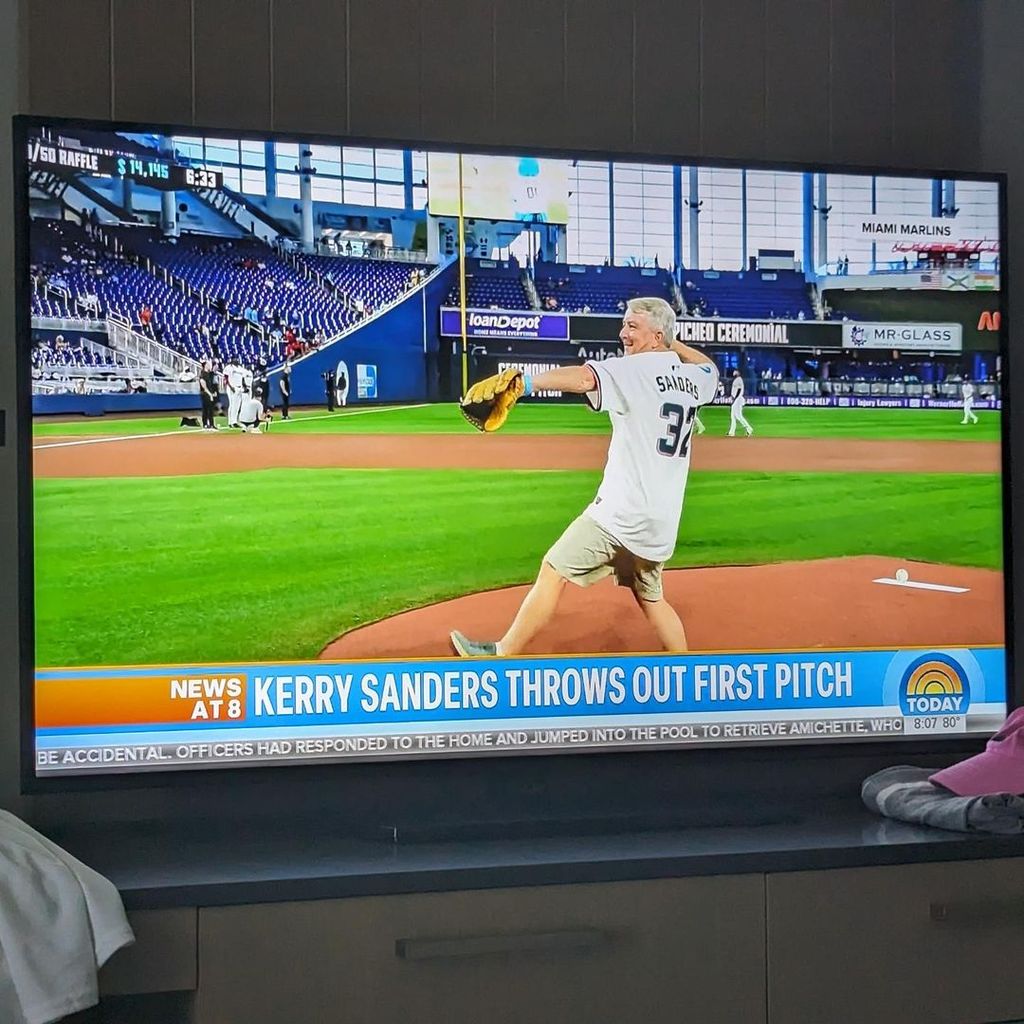 Kerry Sanders captures his segment on the Today Show after throwing the first pitch at a Miami Marlins game