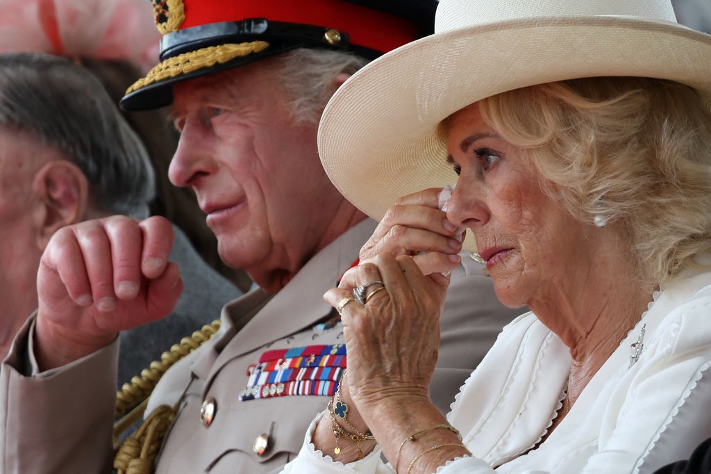 Queen Camilla wipes away tears