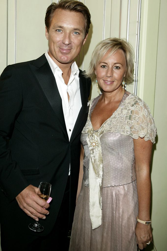 Martin Kemp in a suit and his wife Shirlie in a white lace top