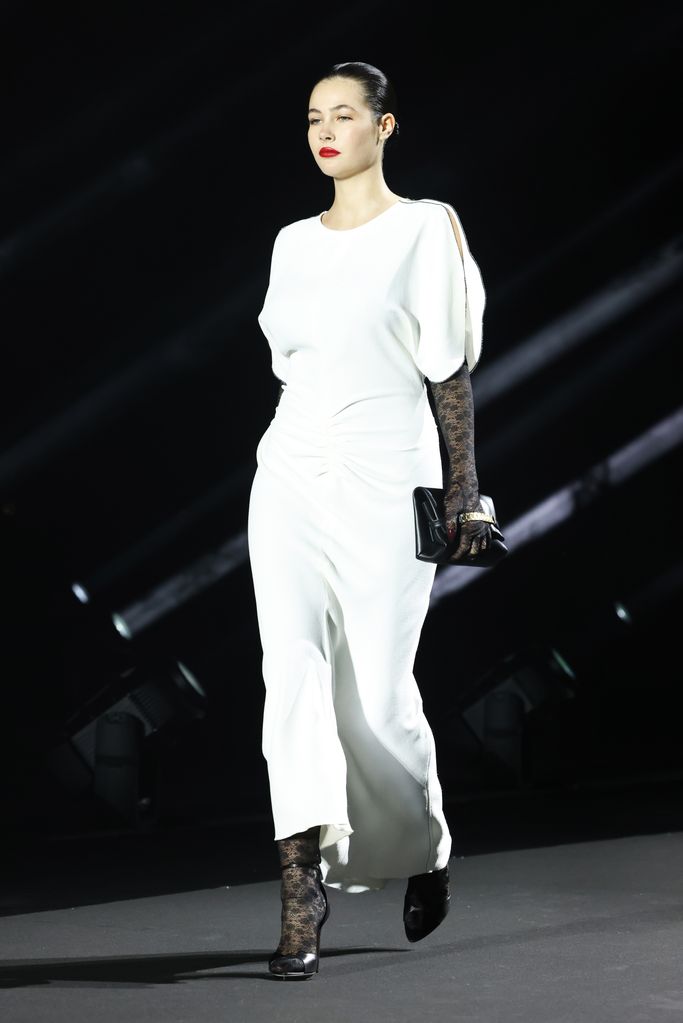Grace Burns walks the runway at the LuisaViaRoma & British Vogue "Runway Icons" show at Piazzale Michelangelo on June 14, 2023 in Florence, Italy. 