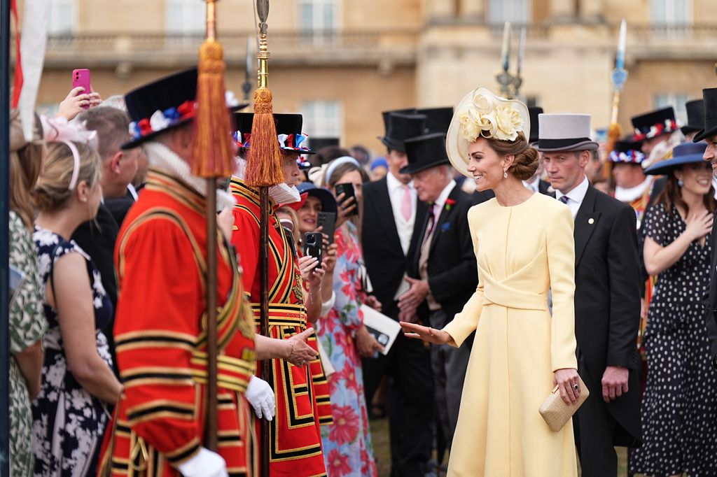 Kate Middleton greets guests during a Royal Garden Party