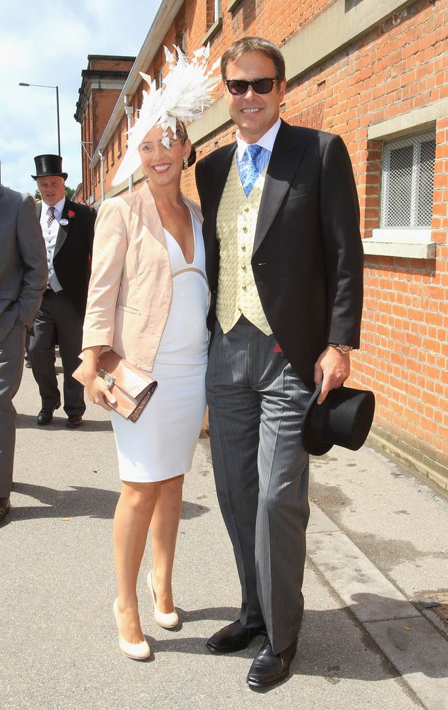 Peter Jones in a morning suit with girlfriend Tara Capp in a white dress and feathered hat