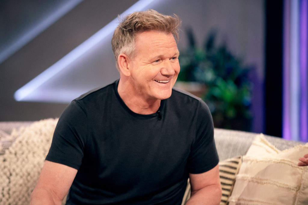 Gordon Ramsay in a T-shirt sat on sofa