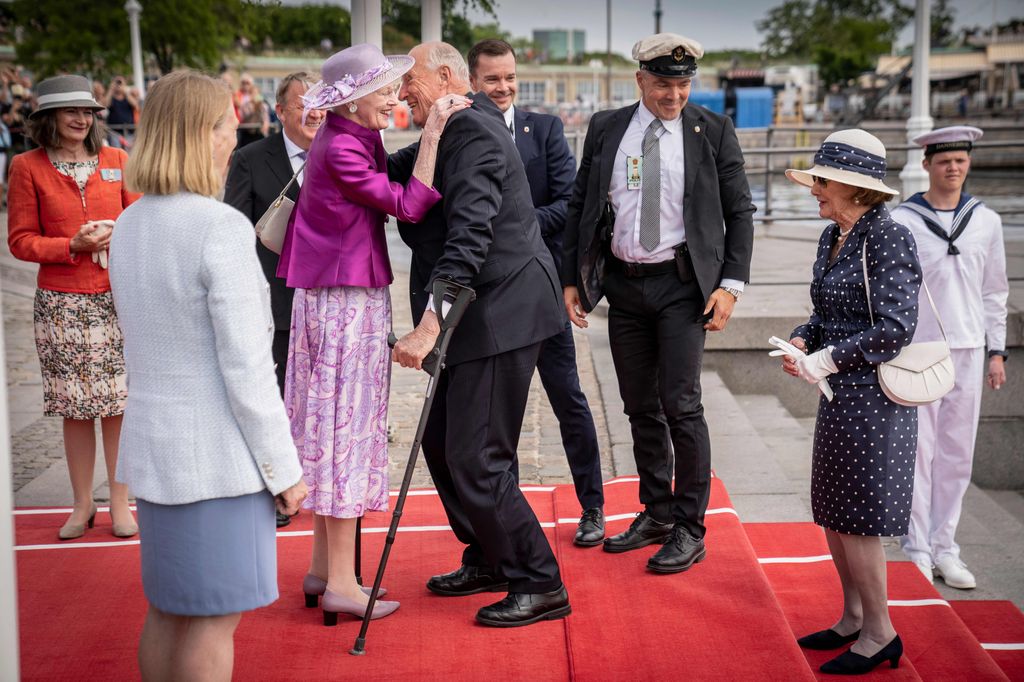 King Harald V of Norway takes a tumble as he visits Queen Margrethe