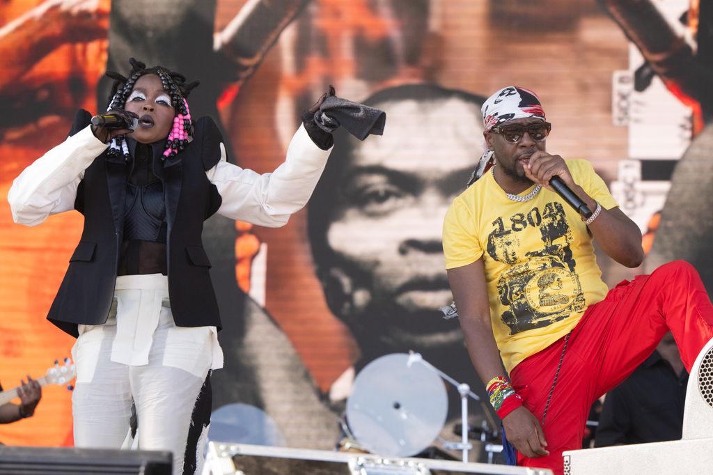 INDIO, CALIFORNIA - APRIL 21: (FOR EDITORIAL USE ONLY) (-(L-R) Singers Lauryn Hill and Wyclef Jean of The Fugees performs onstage during Weekend 2 - Day 3 of the Coachella Valley Music & Arts Festival at Empire Polo Club on April 21, 2024 in Indio, California. (Photo by Scott Dudelson/Getty Images for Coachella)