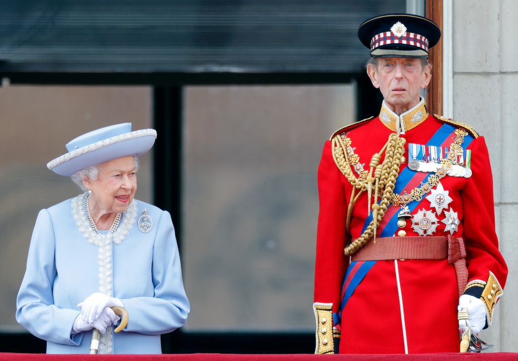 Queen Elizabeth II standing with the Duke of Kent