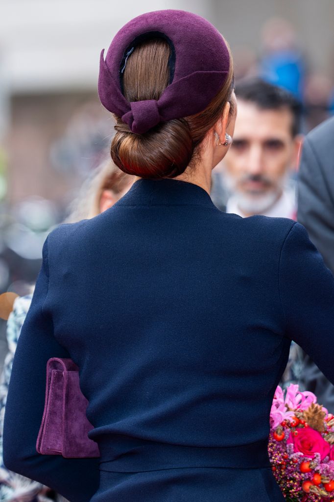 Queen Mary wore a plum suede headband