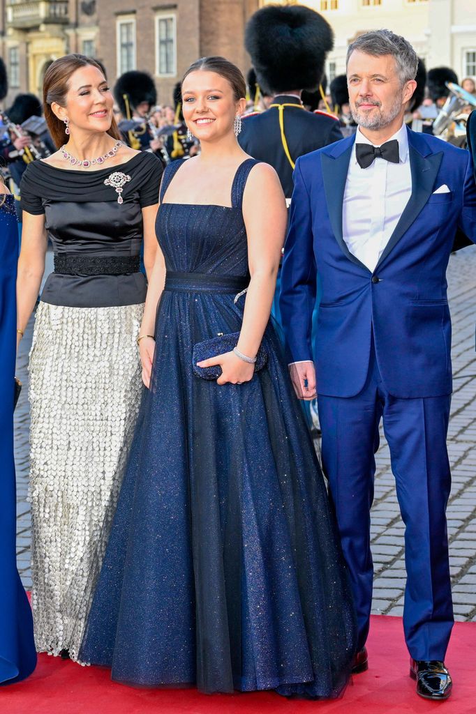 King Frederik, Queen Mary, Princess Isabella pose on red carpet