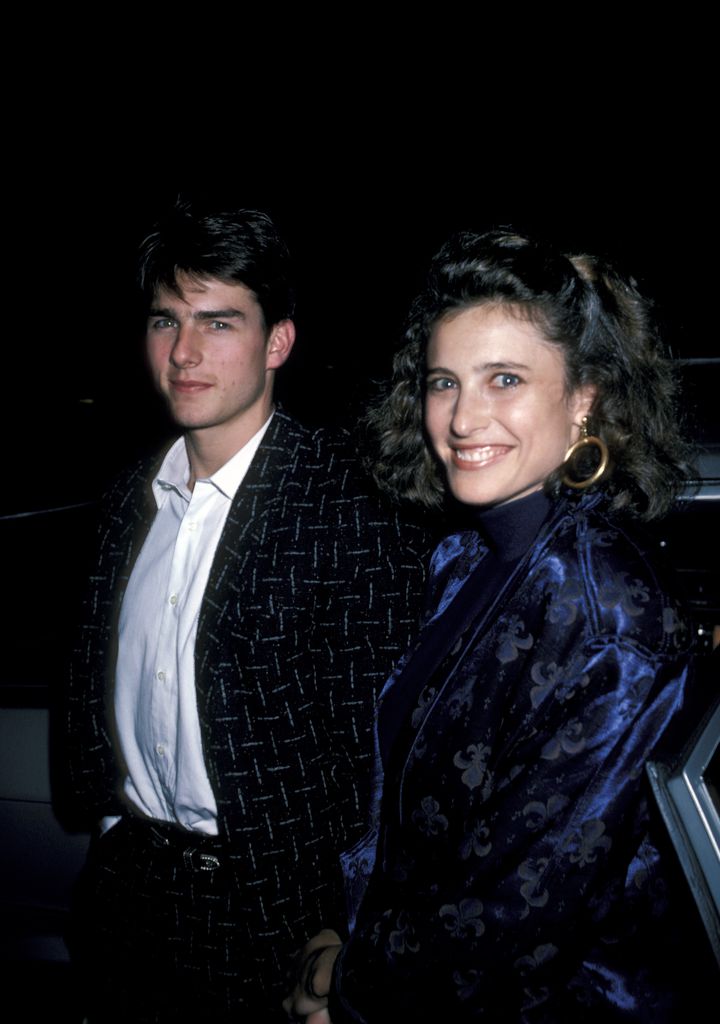 Tom walking with first wife Mimi Rogers