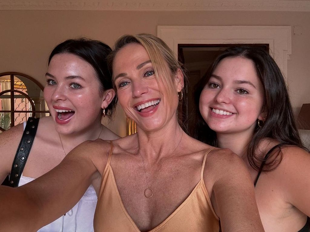 Amy Robach taking a selfie with her two daughters 