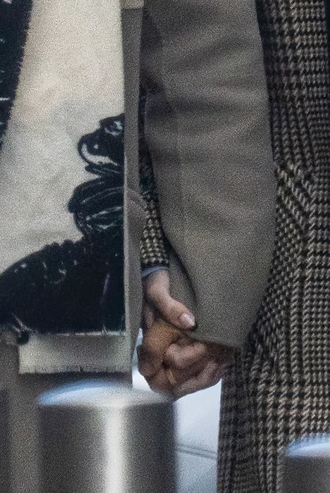 Nikita Kuzmin holding Charlies hand