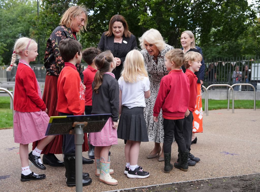 Queen Camilla with a group of children