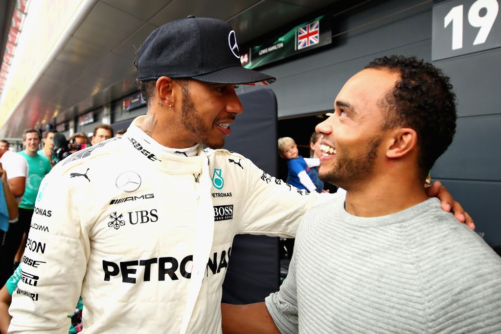 Lewis Hamilton with his arm around Nicolas Hamilton