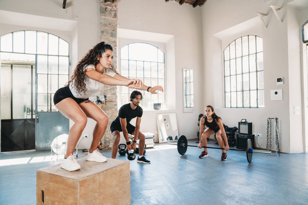 People doing cross training in an health club.