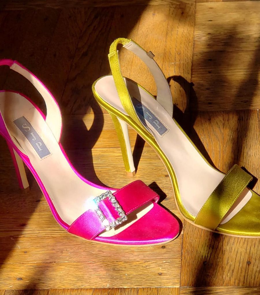 Mismatched pink and yellow satin heels