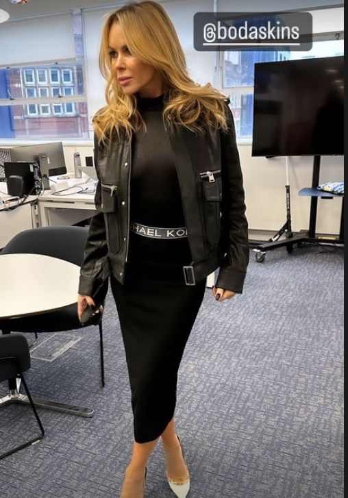 Amanda Holden in black outfit with matching leather jacket