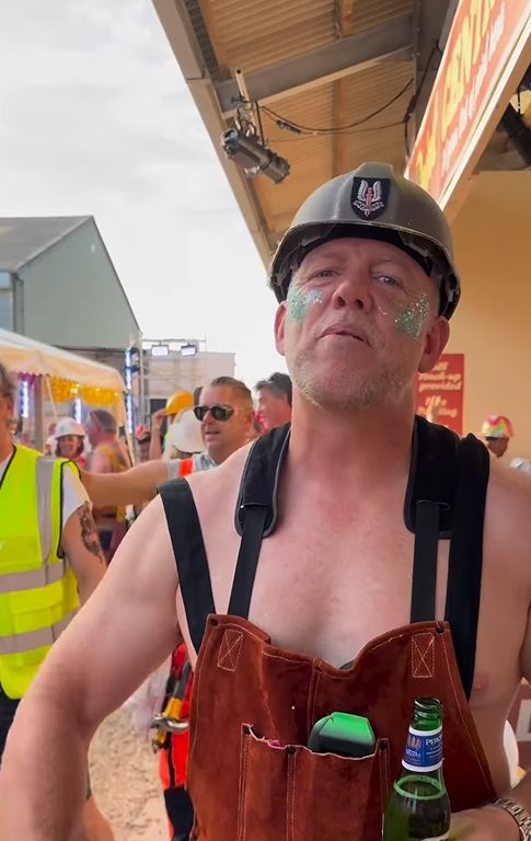 Mike Tindall in a pair of red dungarees and a builder's hat
