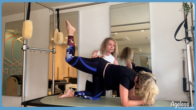 woman working out on a pilates bed