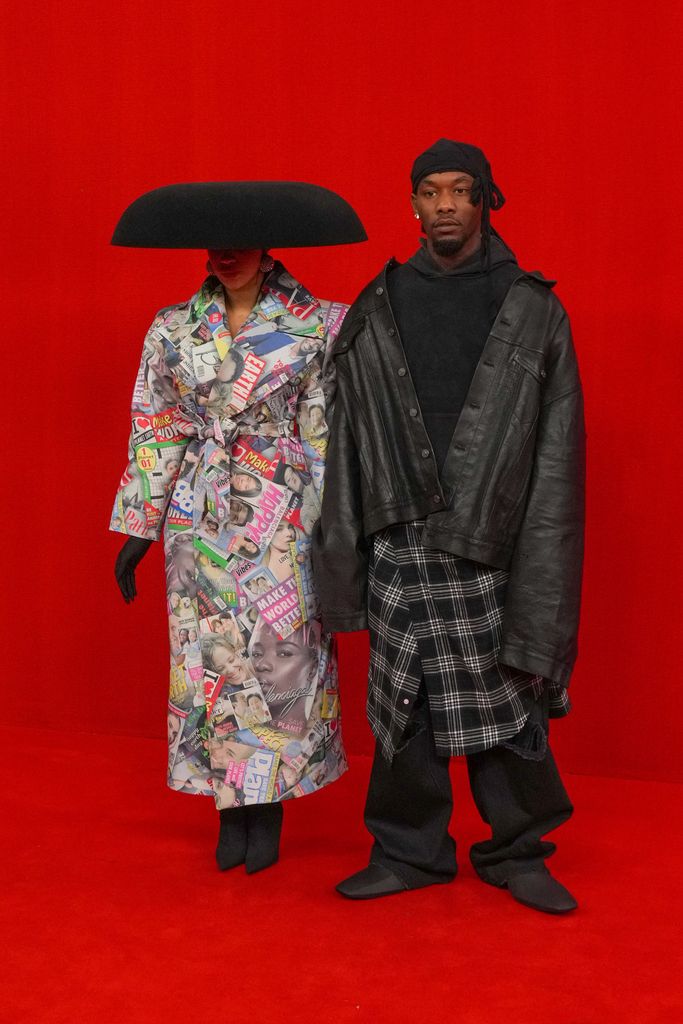 Cardi B and Offset walk the runway during the Balenciaga SS22 show show as part of Paris Fashion Week at Theatre Du Chatelet on October 02, 2021 in Paris, France. (Photo by Peter White/Getty Images)