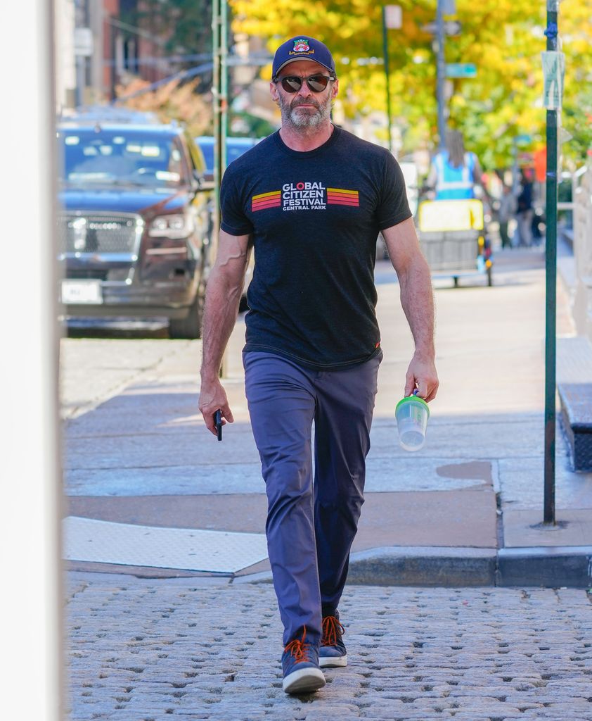 Hugh Jackman arrives at Bradley Cooper's NYC pad
