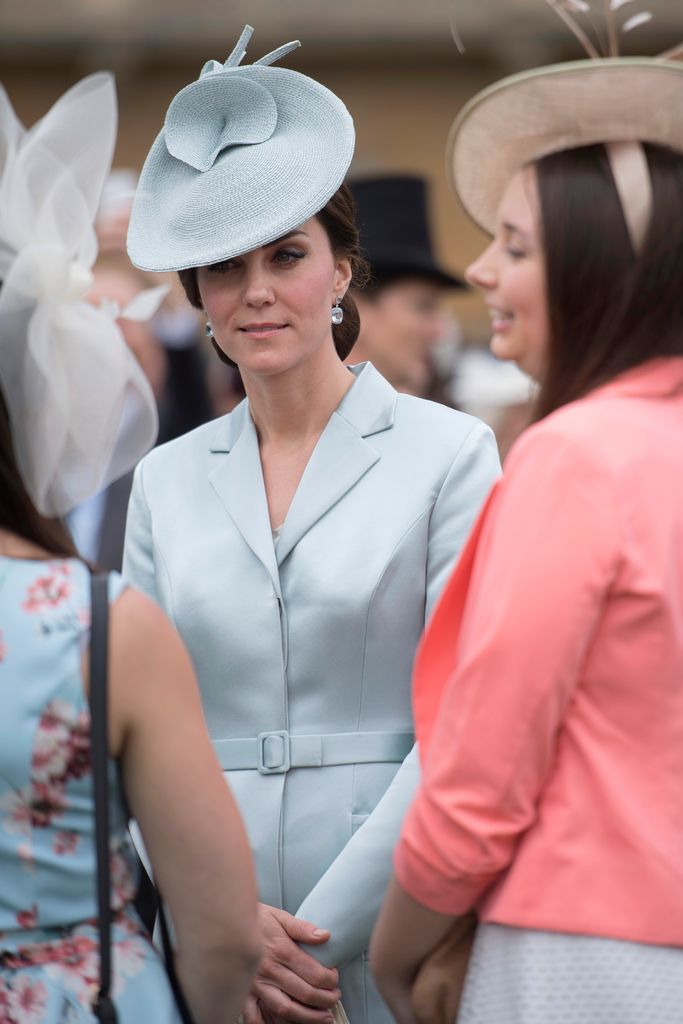 Catherine,  Duchess of Cambridge talks to guests during a garden party at Buckingham Palace  on May 16, 2017 in London, England.
