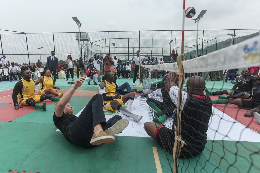 Prince Harry takes part in a sitting volleyball match at Nigeria Unconquered, a local charity organisation that supports wounded, injured, or sick servicemembers, in Abuja