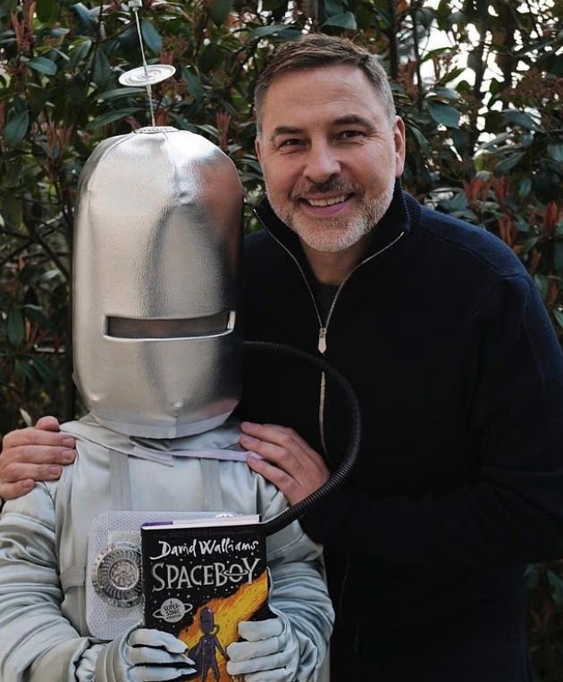 David Walliams with his son, who is wearing a spaceman costume