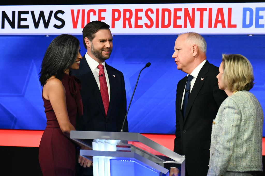 (L-R) US Senator and Republican vice presidential candidate J.D. Vance and his wife Usha Vance greet Minnesota Governor and Democratic vice presidential candidate Tim Walz and his wife Gwen Walz at the end of the Vice Presidential debate hosted by CBS News at the CBS Broadcast Center in New York City on October 1, 2024