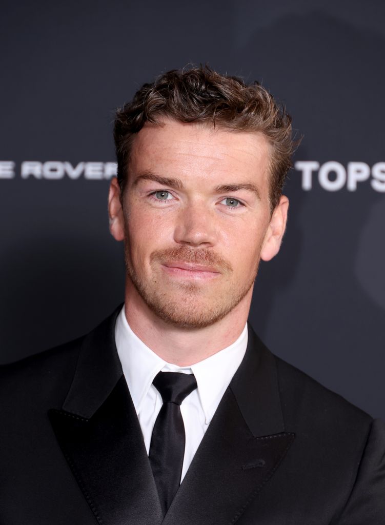 Will Poulter in a suit